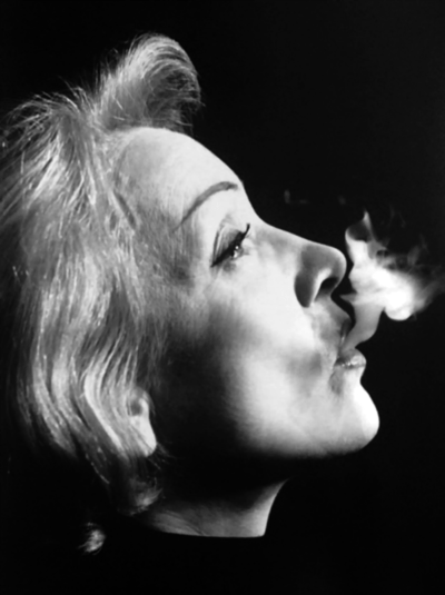 Marlene Dietrich, inhales – BEGUILING HOLLYWOOD